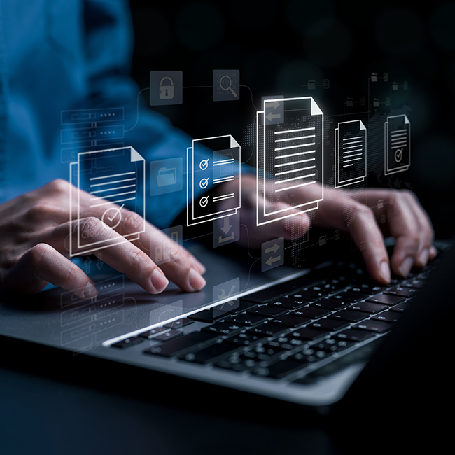 Floating document icons over man typing on a keyboard
